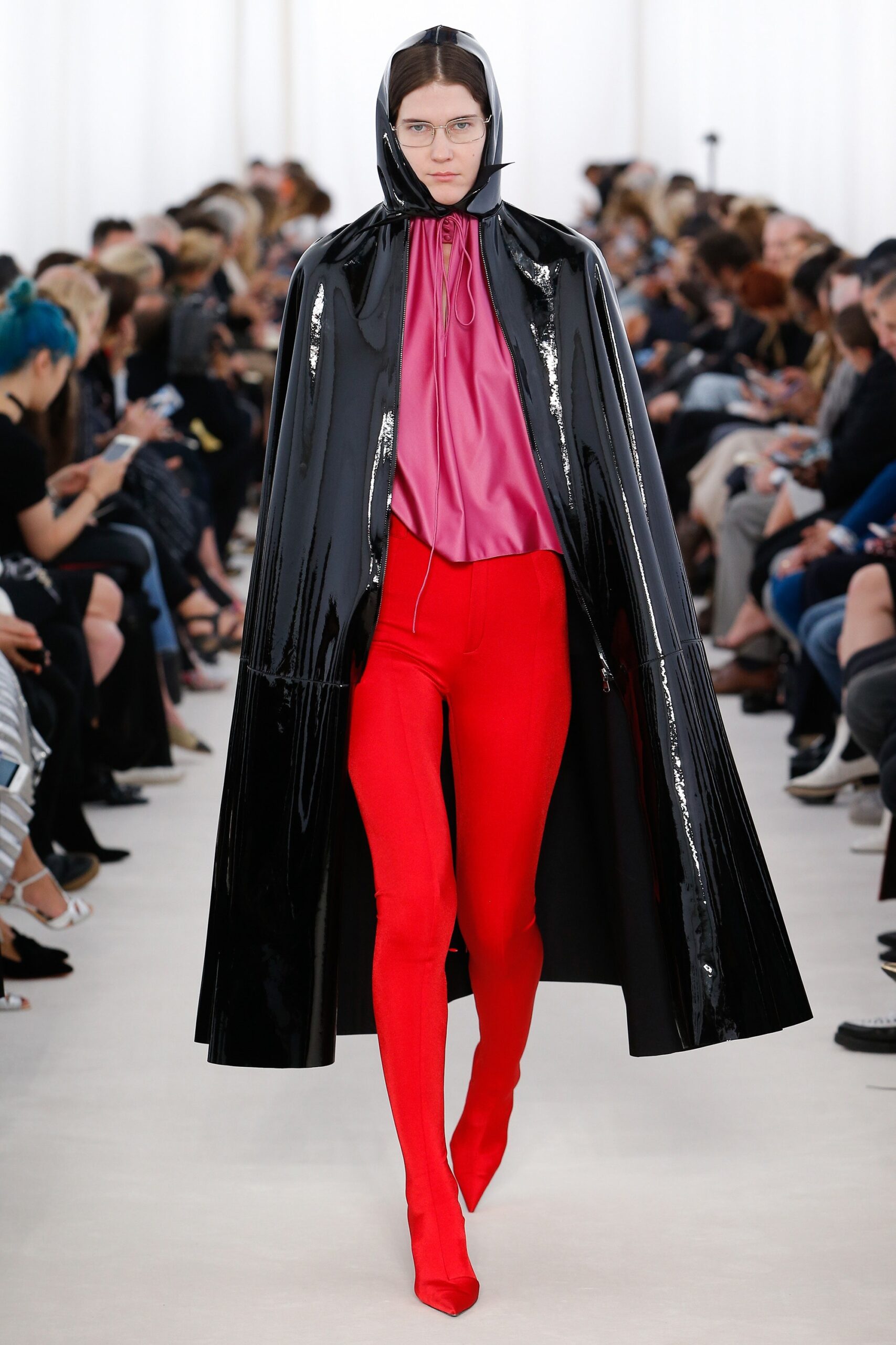 black vinyl cape pink silk top red vinyl pants