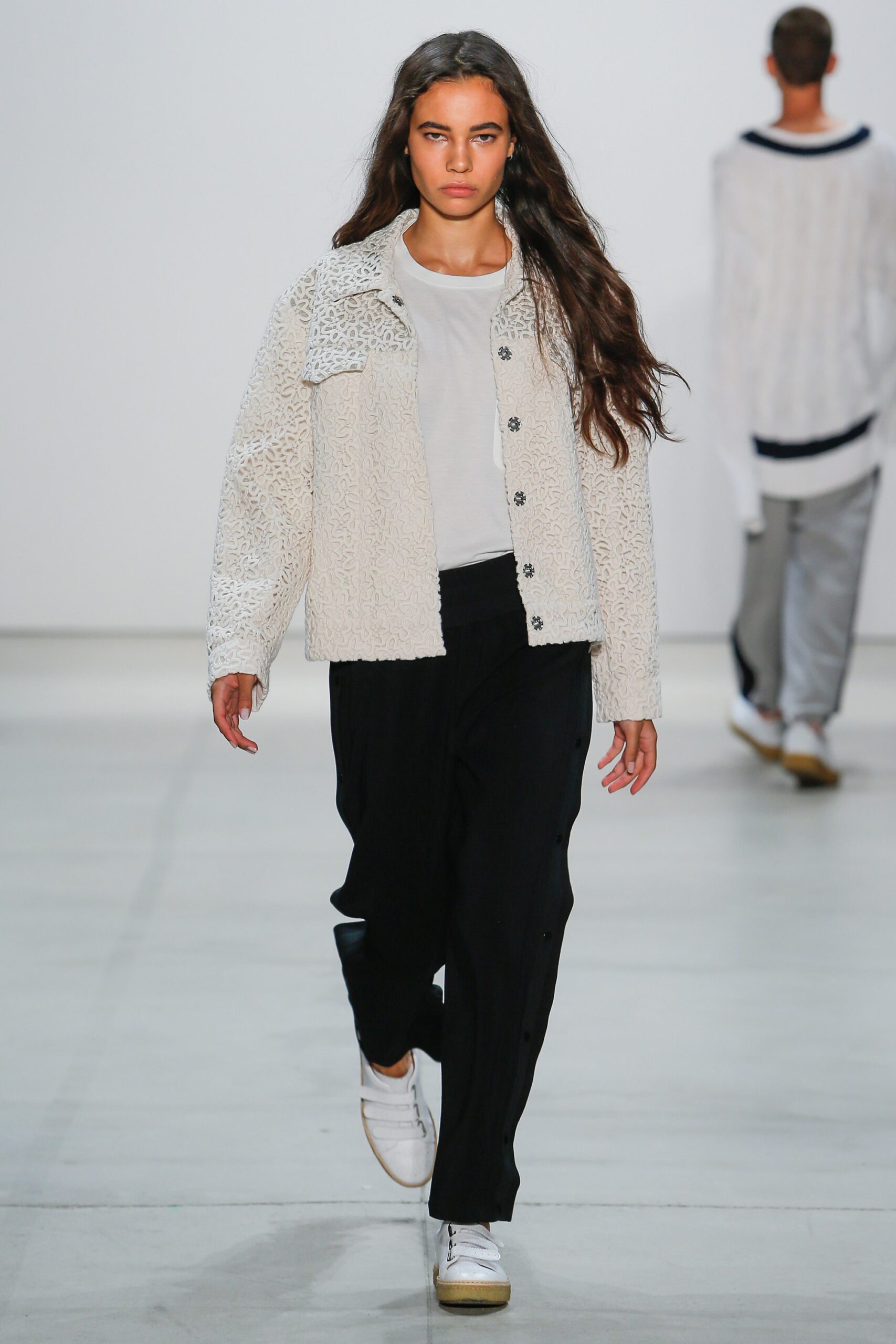 white embroidered jacket with black pants