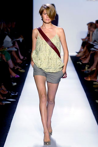 light green embroidered top with gray shorts