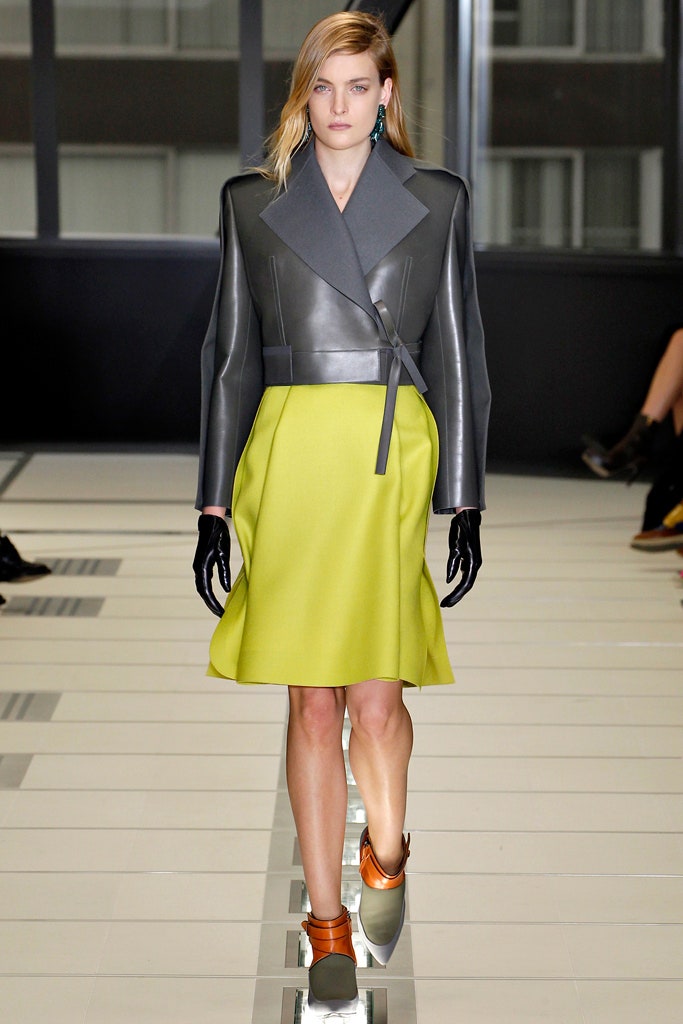 gray leather structured jacket and yellow a-line skirt