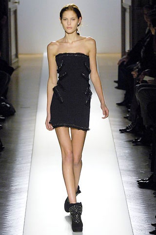 black fitted mini-dress with embellishments