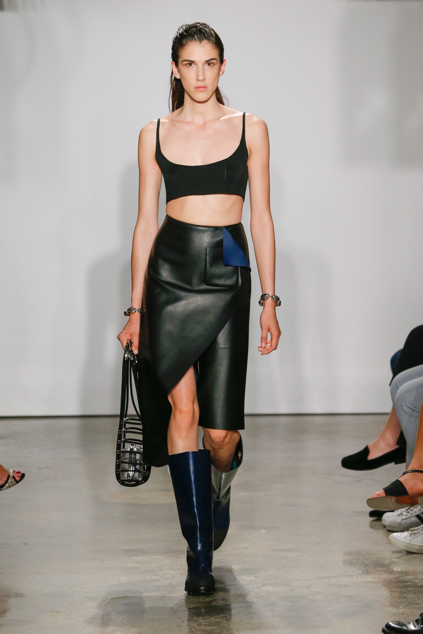 black crop-top and leather skirt
