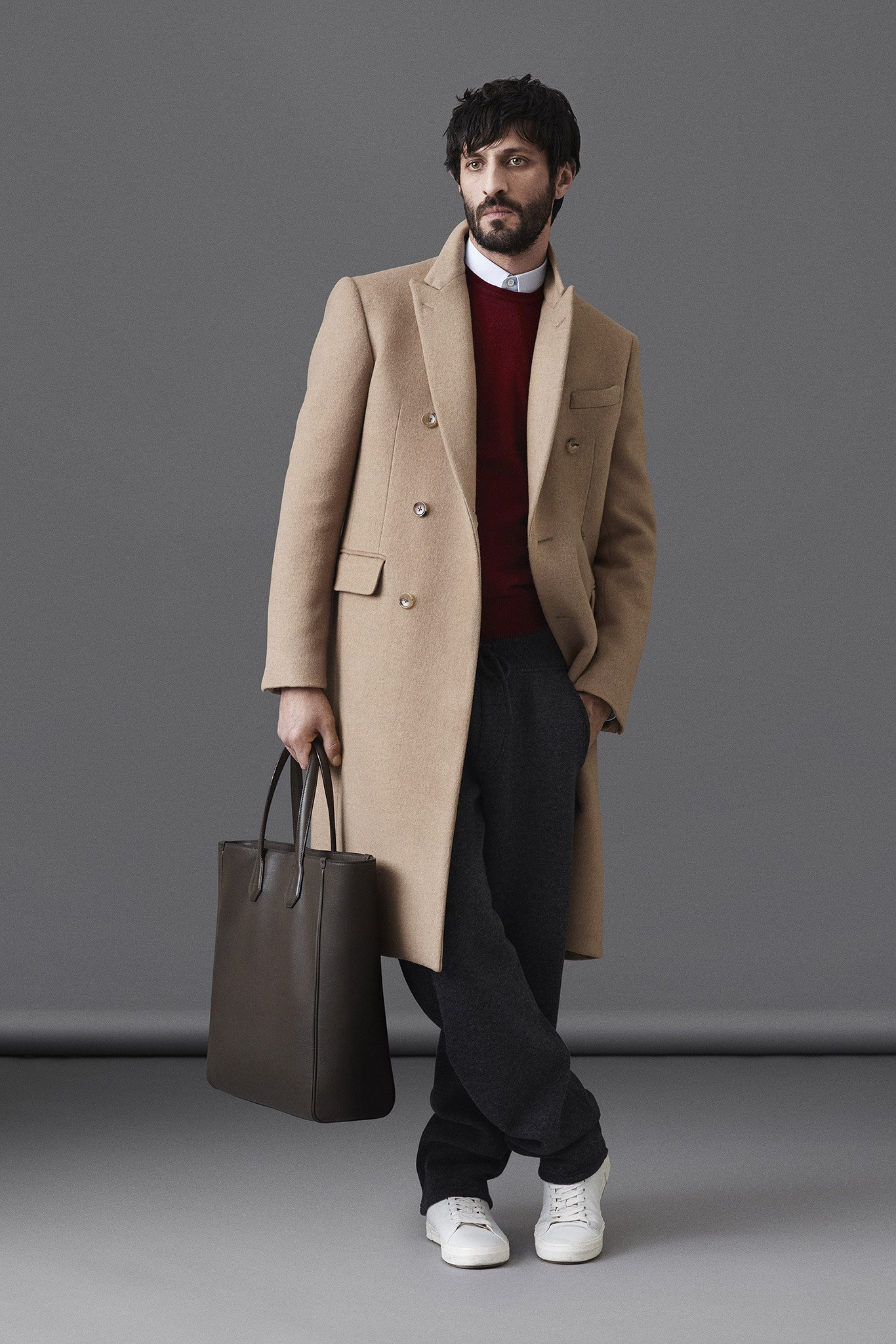 beige wool coat with red sweater