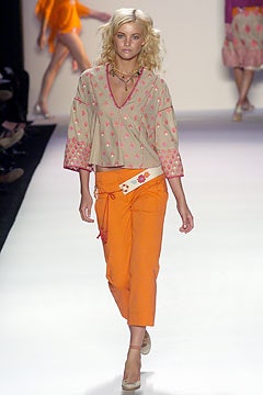 beige embroidered top with orange pants