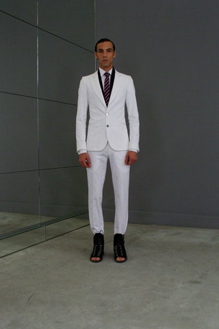 white tailored suit with black shoes