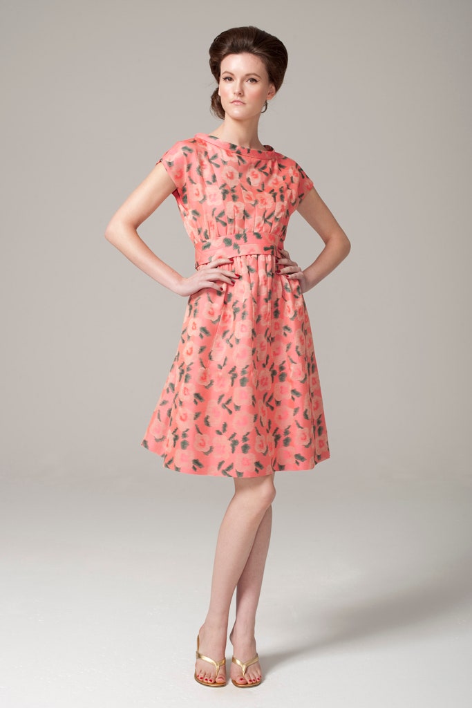 pink printed midi dress with gold shoes