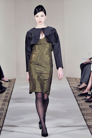 gold silk fitted midi dress with black jacket