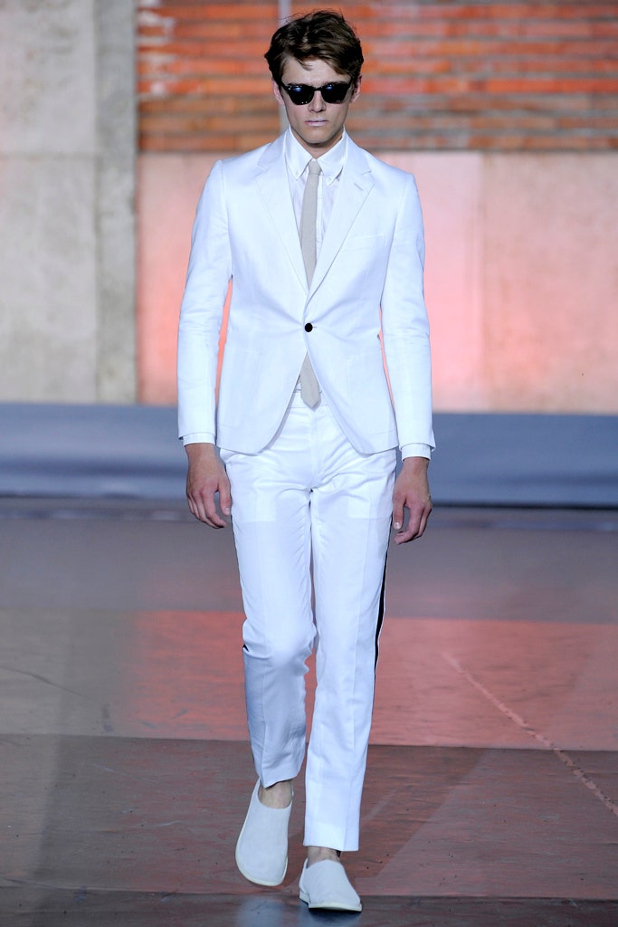 white tailored suit with sunglasses