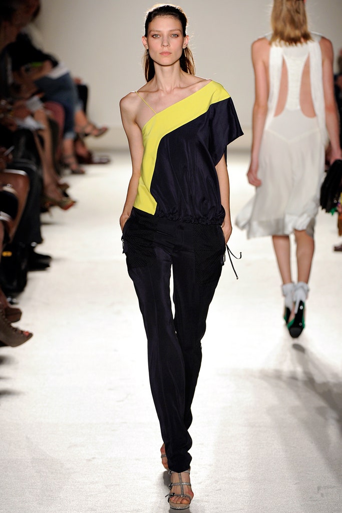 asymmetric black and yellow top with relaxed pants