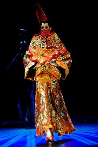 orange printed maxi dress with red hat