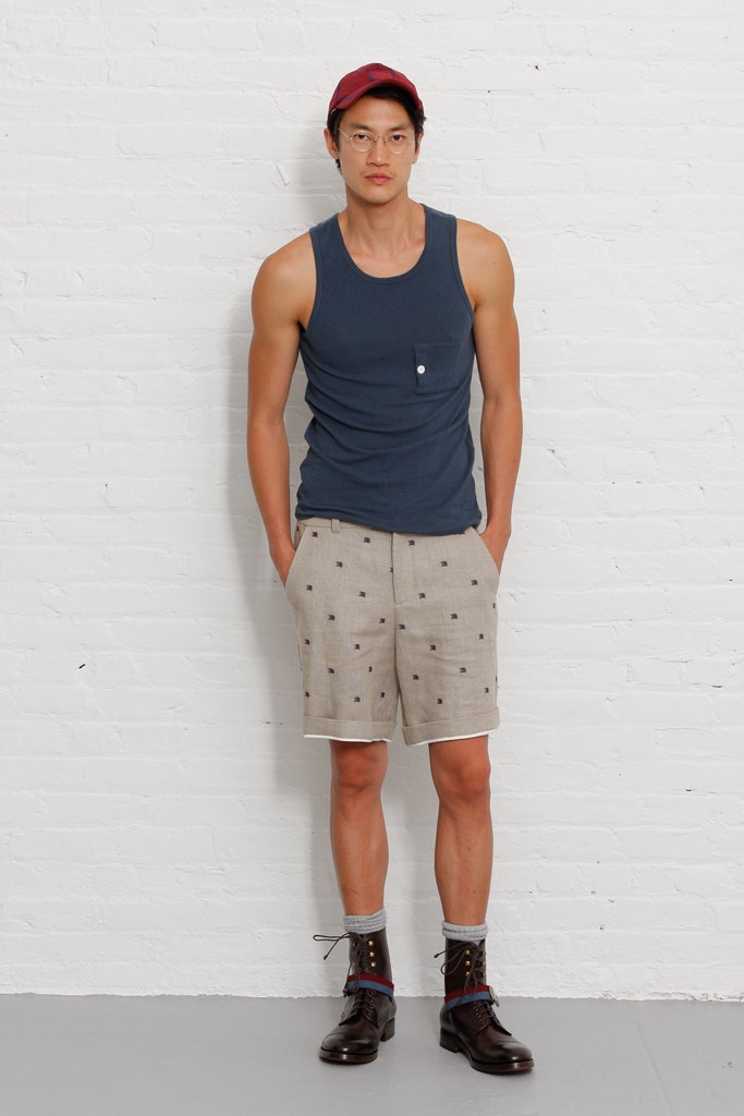 blue tank-top with beige shorts