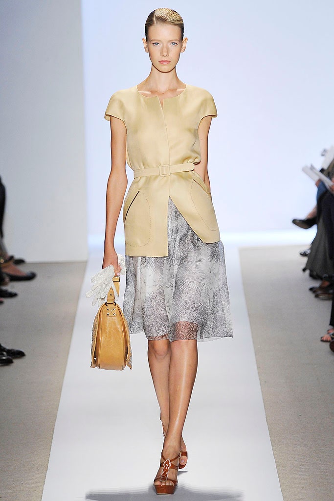 beige fitted top with gray pleated skirt