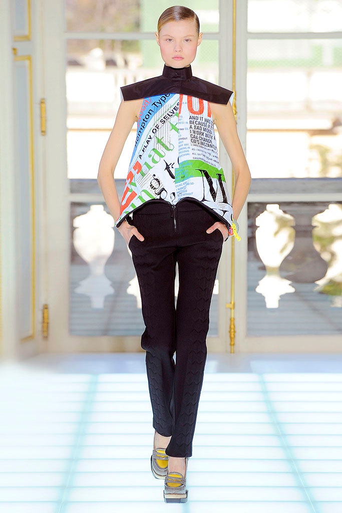 fitted white multi-layered top with black pants
