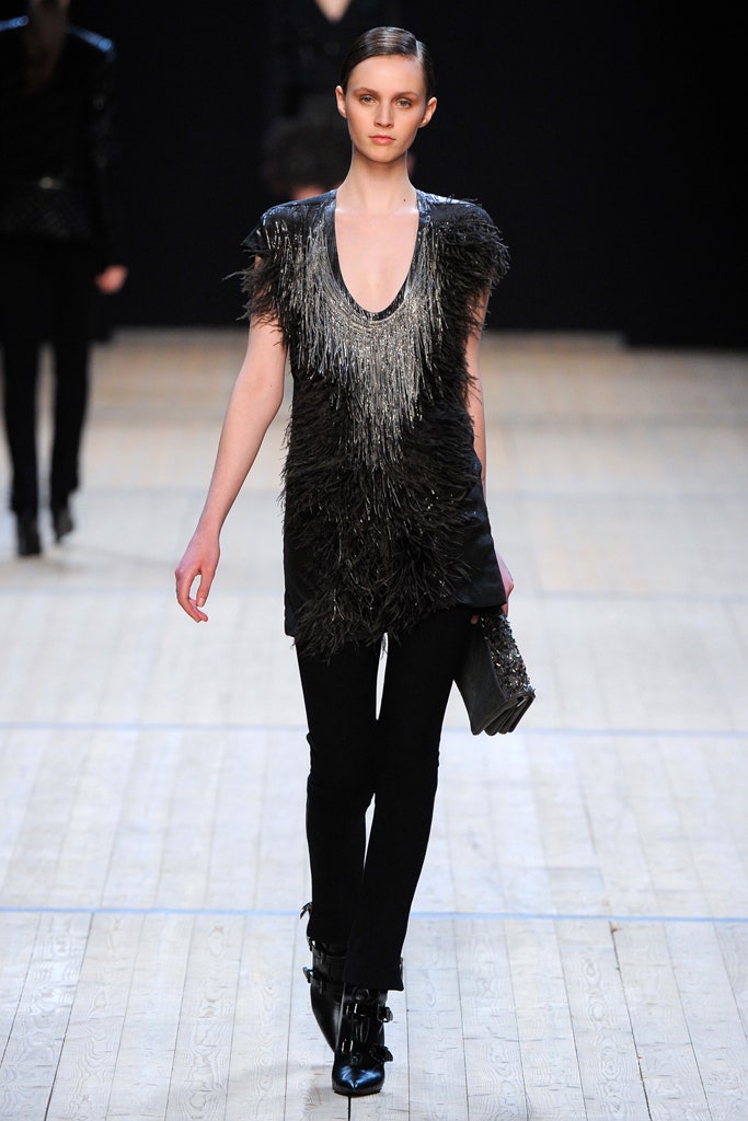 black fringed top with slim pants