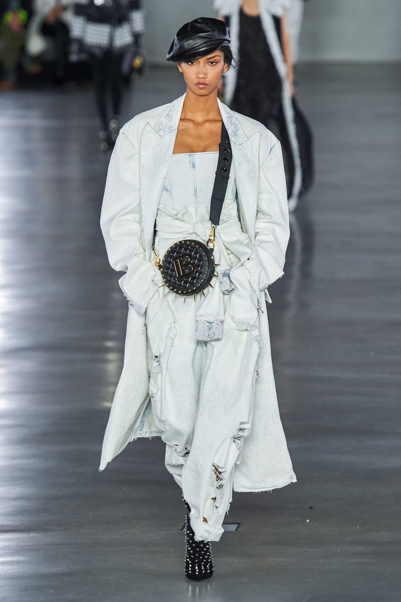 white denim coat with distressed pants