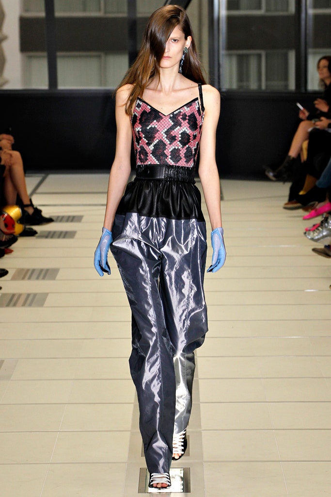 pink silk sleeveless top with gray pants