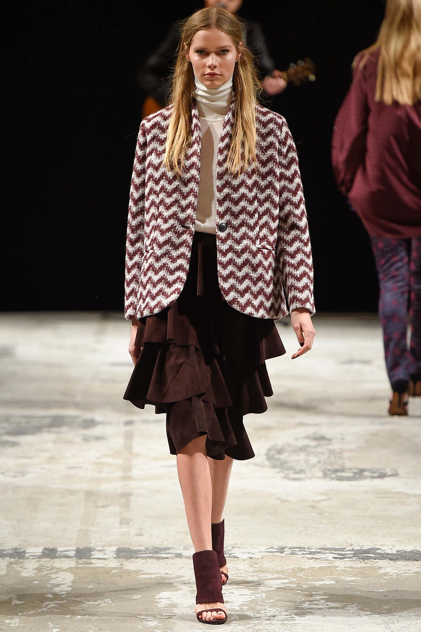 brown and white zigzag blazer with black tiered skirt