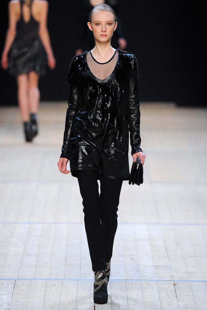 black vinyl fringed top with slim pants