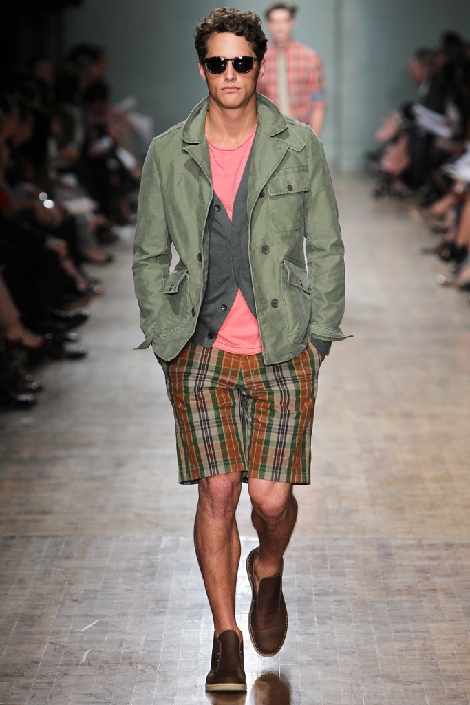 green jacket pink t-shirt plaid shorts