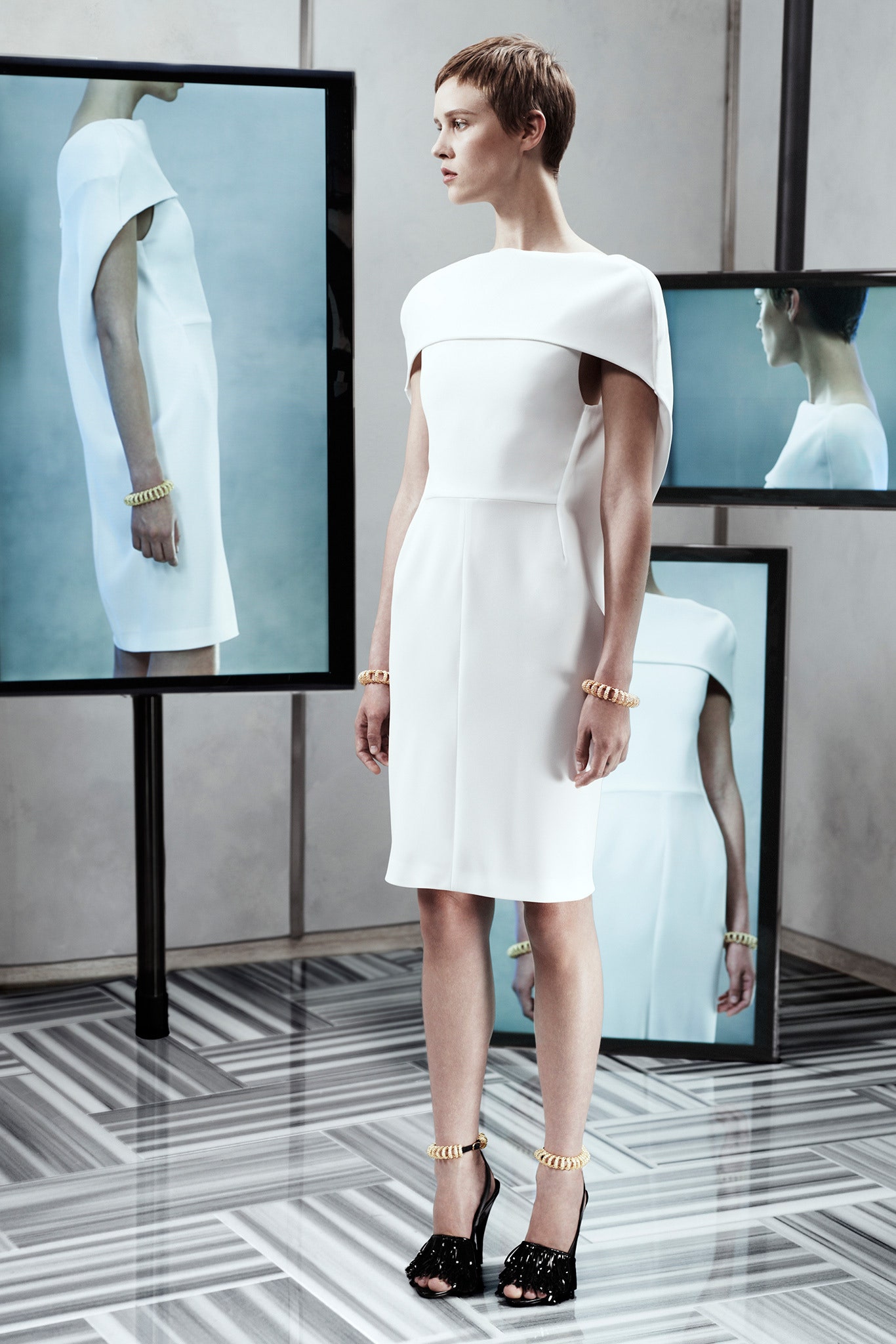 white fitted dress with black shoes