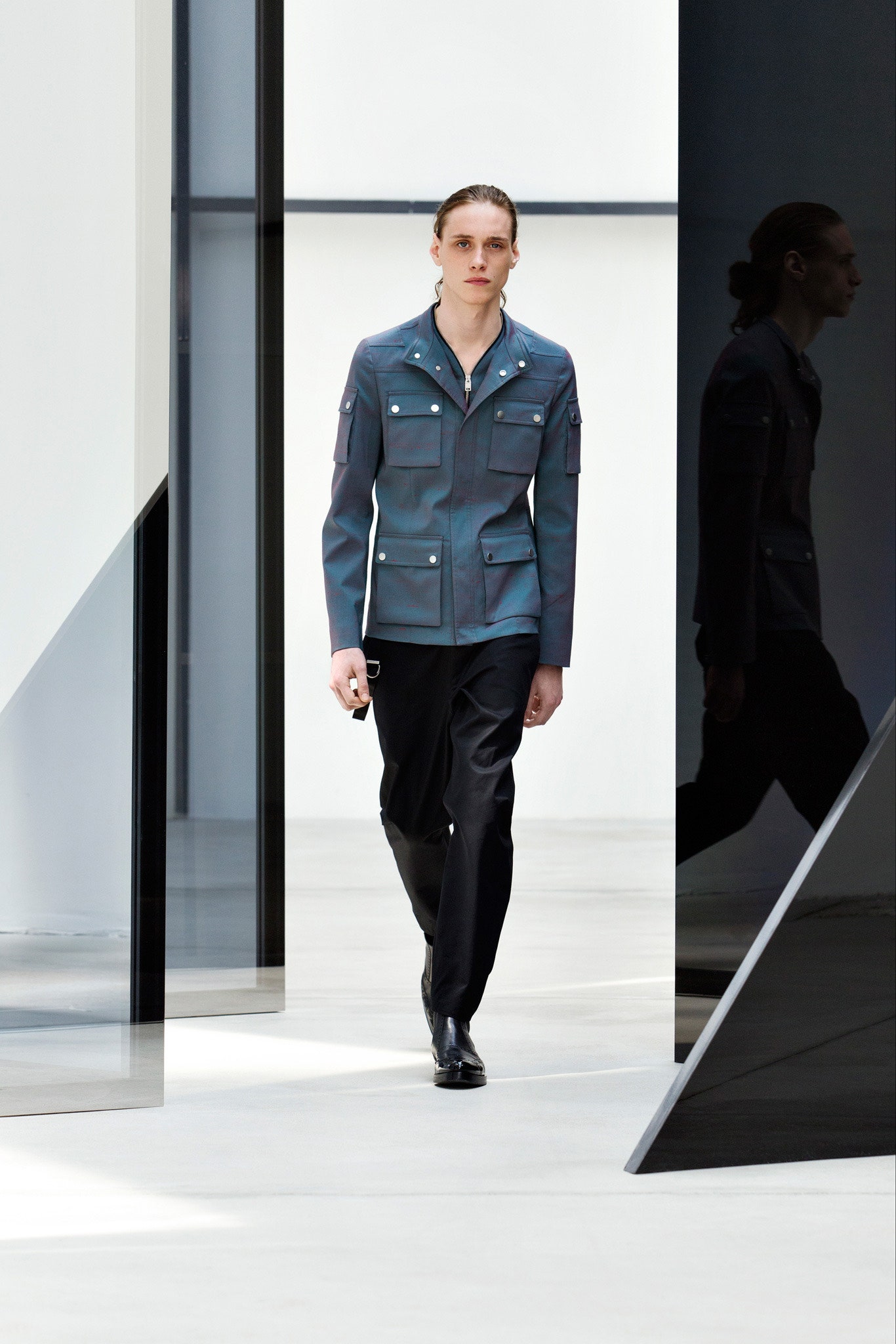 blue fitted jacket and black pants