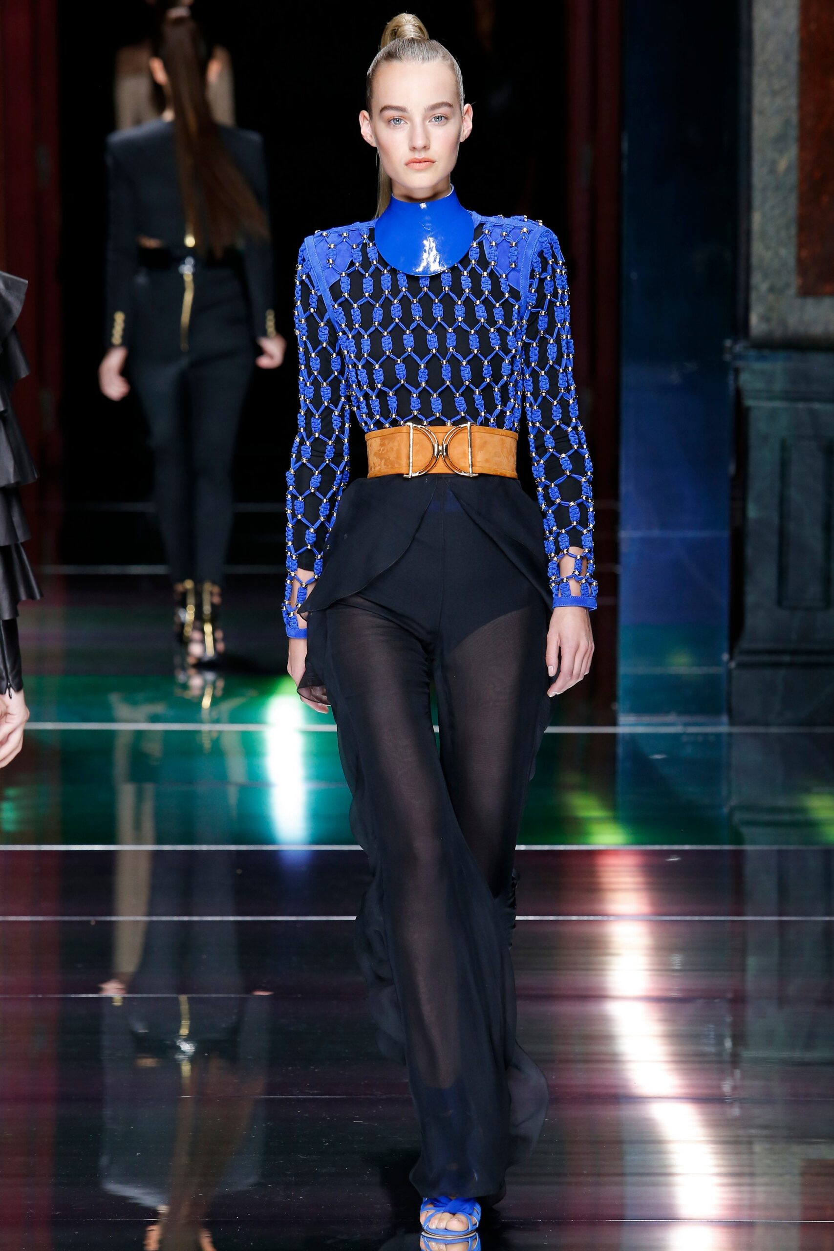 blue silk fitted top with sheer black pants