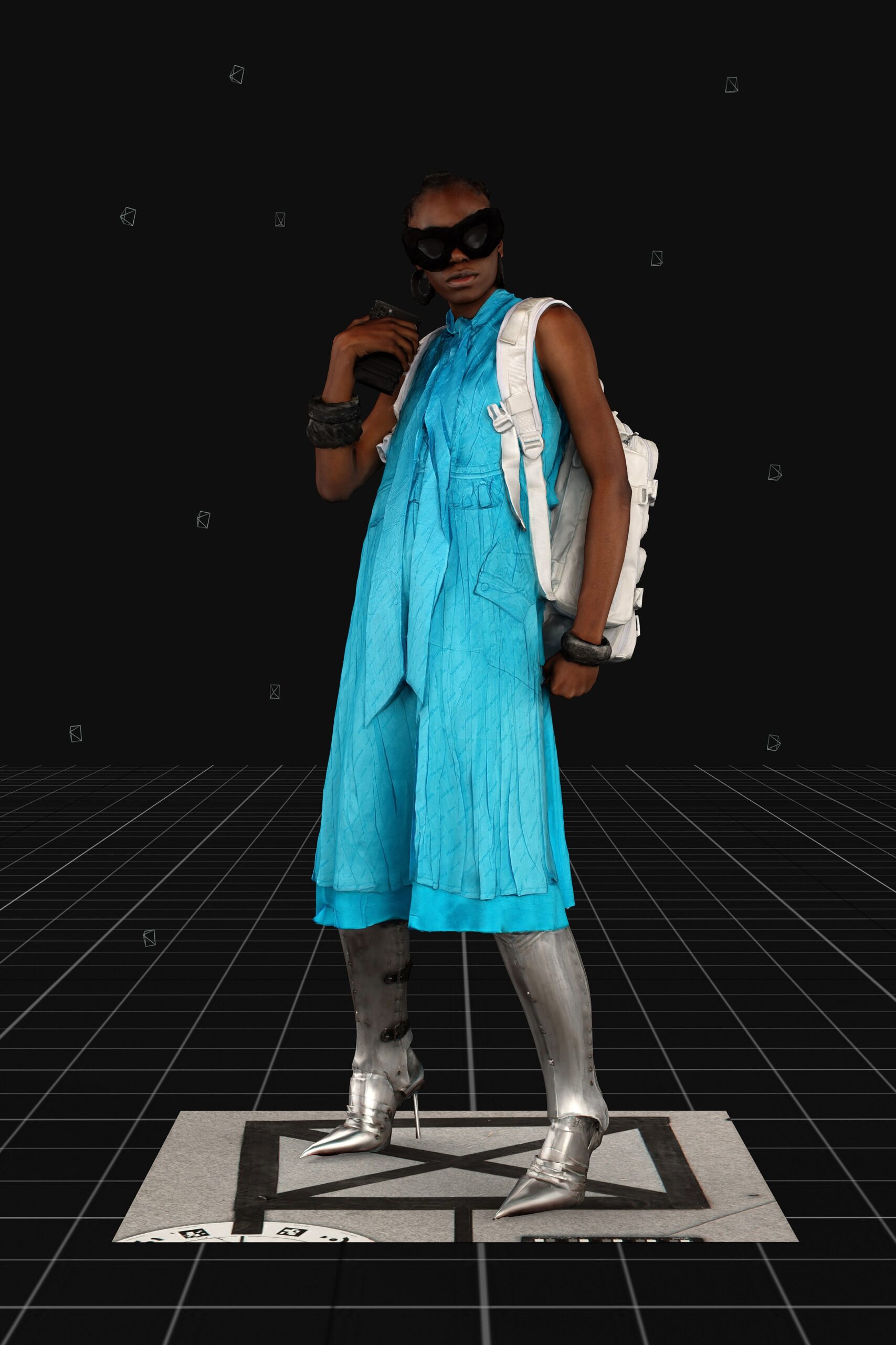 blue relaxed jumpsuit with silver boots