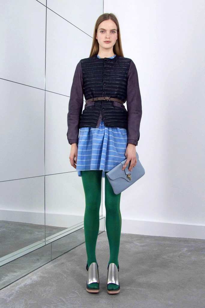 gray blouse black vest blue pleated skirt