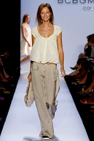 white relaxed top with beige pants
