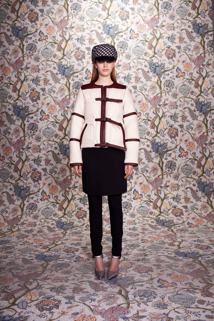 fitted white and brown jacket with black skirt