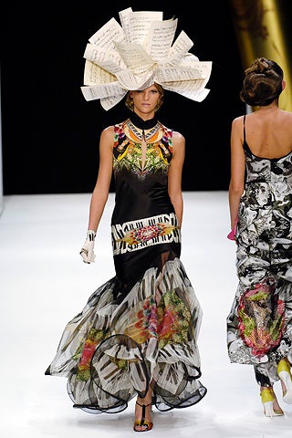 black multi-layered embroidered dress with sculptural hat