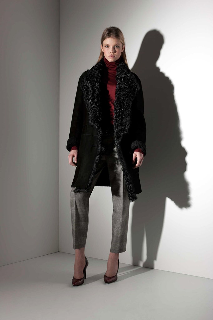 black suede coat with red turtleneck