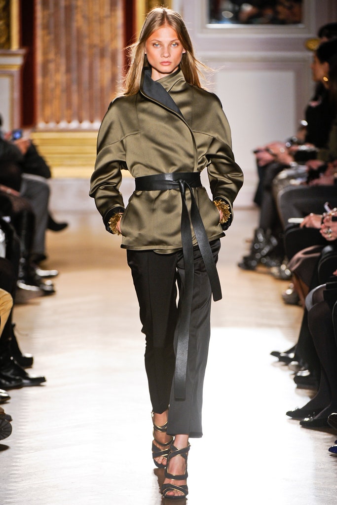 fitted green silk jacket with black pants