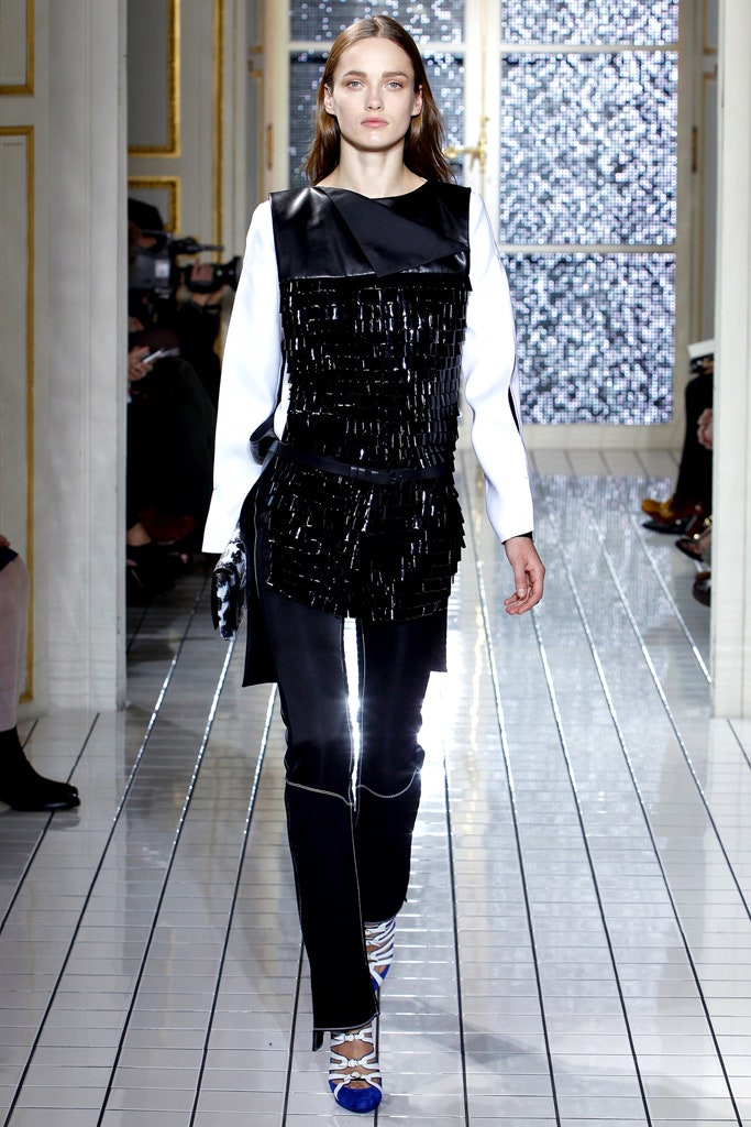 black and white asymmetric top with fitted pants