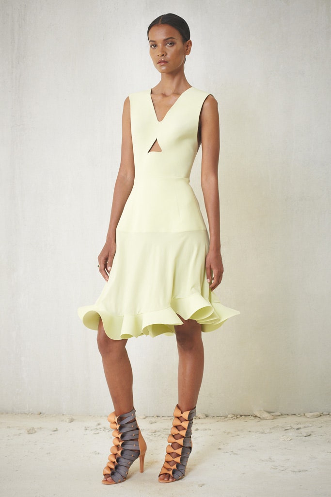 yellow fitted midi dress with strappy shoes