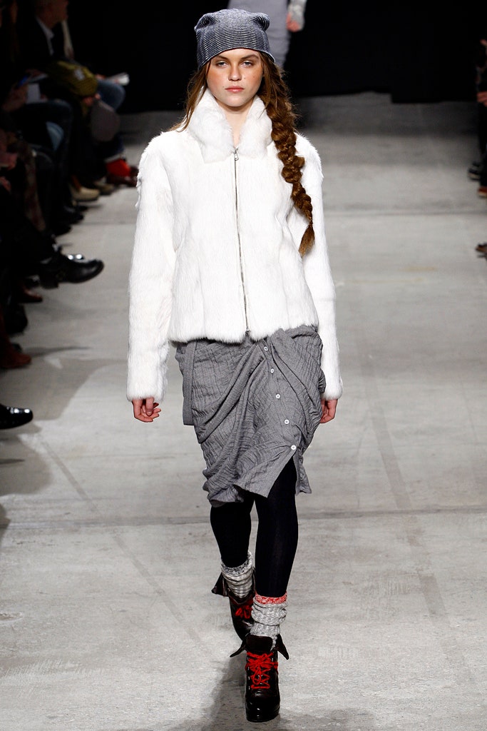 white faux-fur jacket with gray skirt
