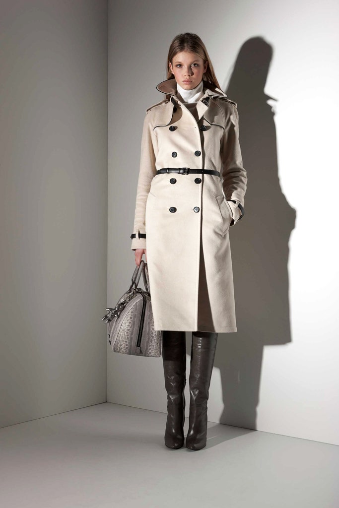 beige fitted trench coat with black boots