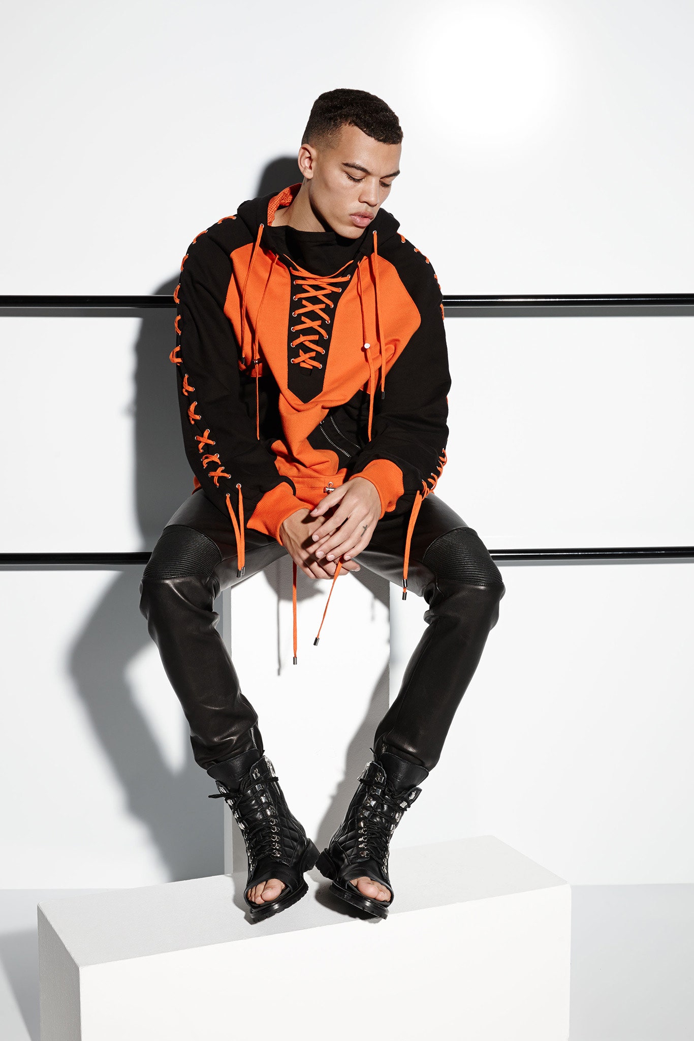 black and orange relaxed hoodie with fitted pants