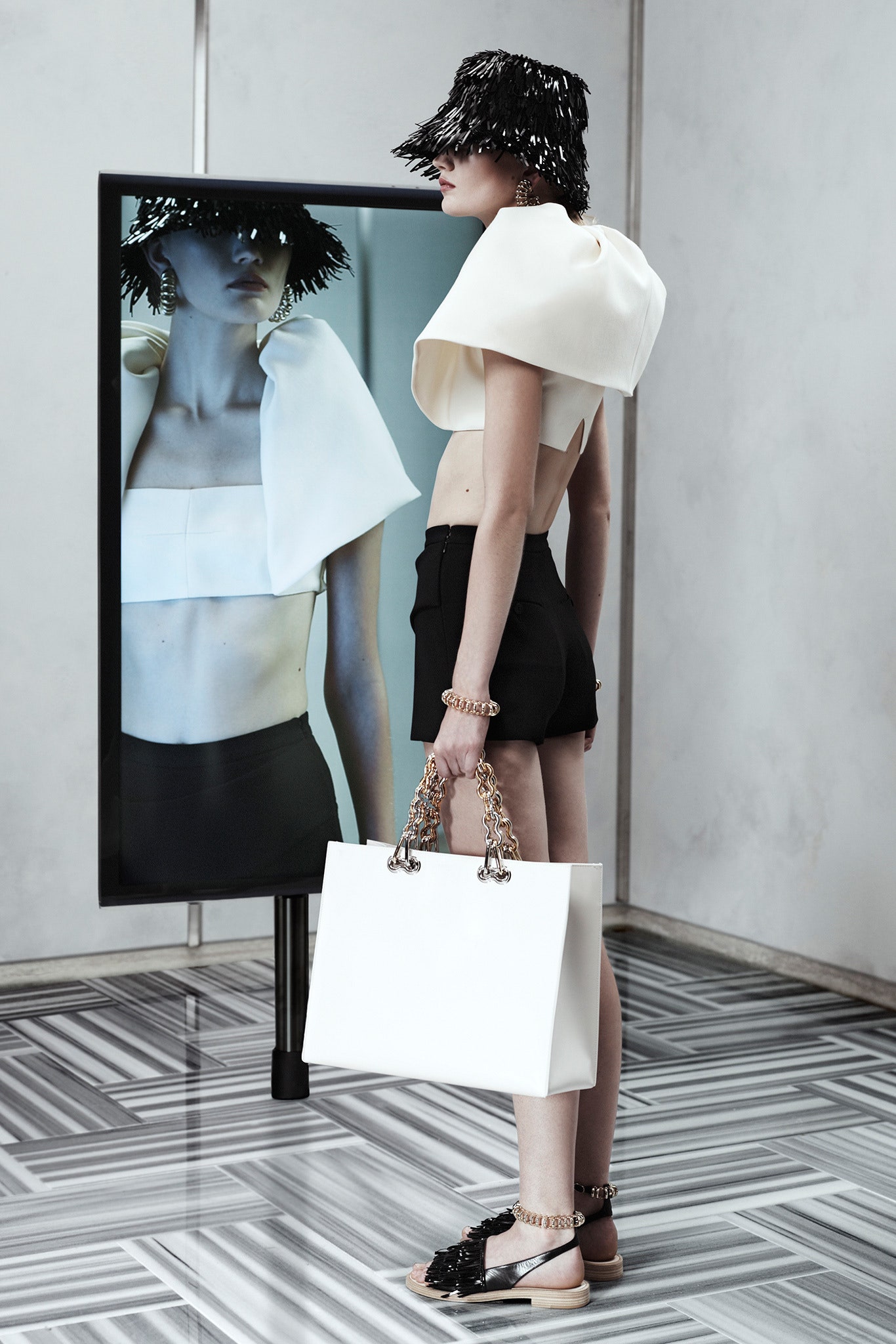 white fitted top with black shorts