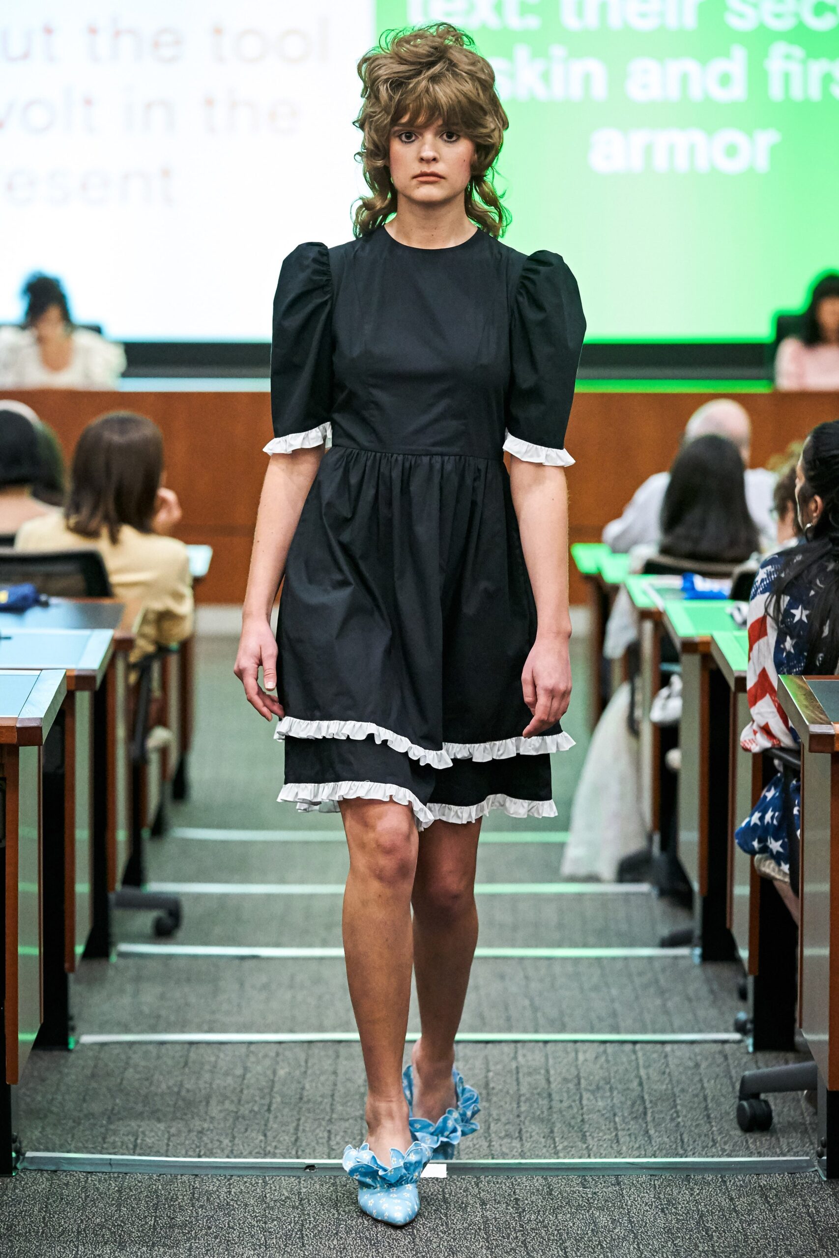 black mini dress with ruffled sleeves