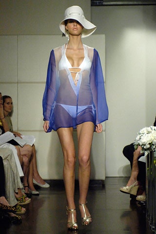 white swimsuit with blue cape