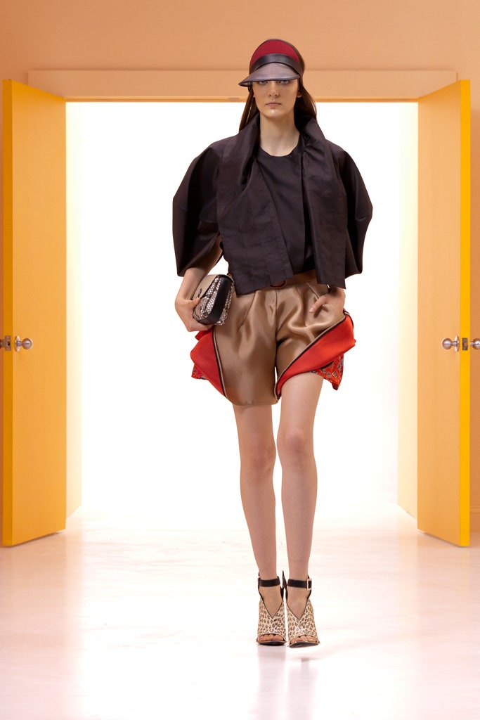 black structured jacket with silk shorts