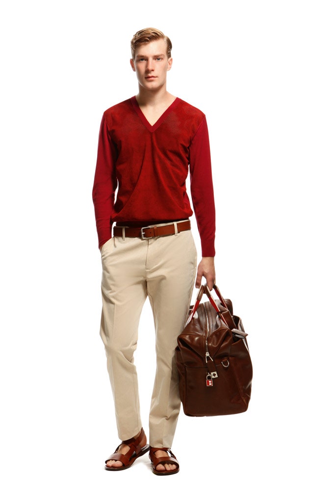 red fitted sweater with beige pants