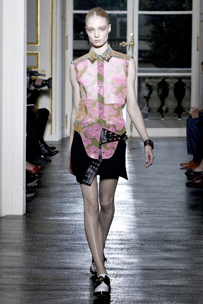 pink embroidered shirt and black skirt