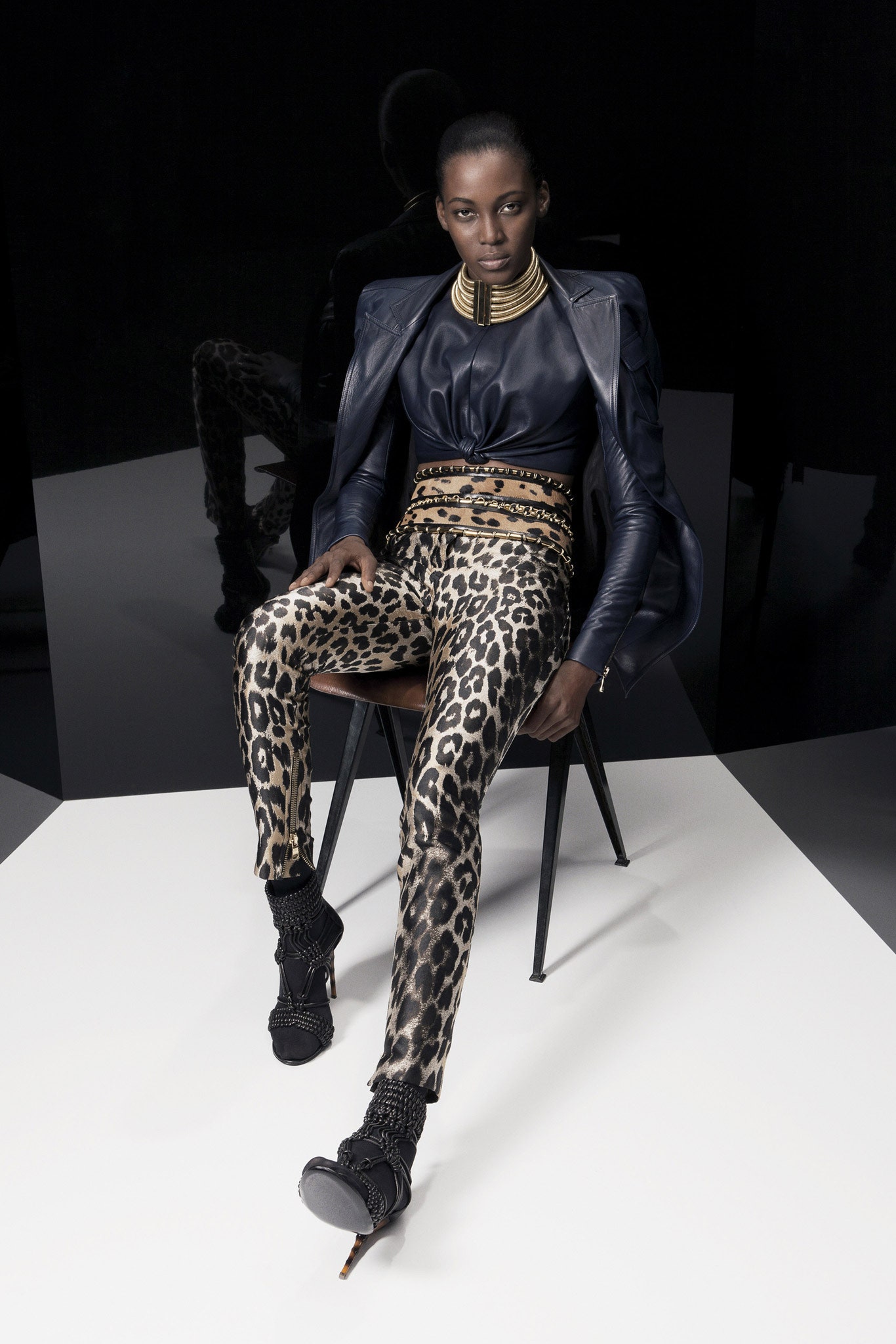 blue leather fitted top with animal-print pants