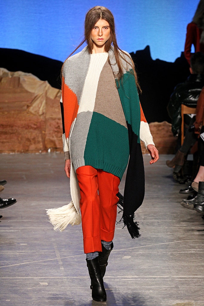 color-blocked wool poncho and tailored red pants