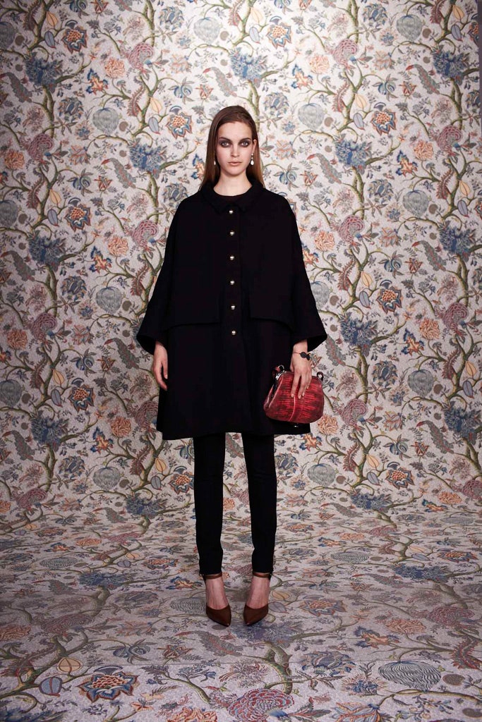 black wool cape with fitted pants