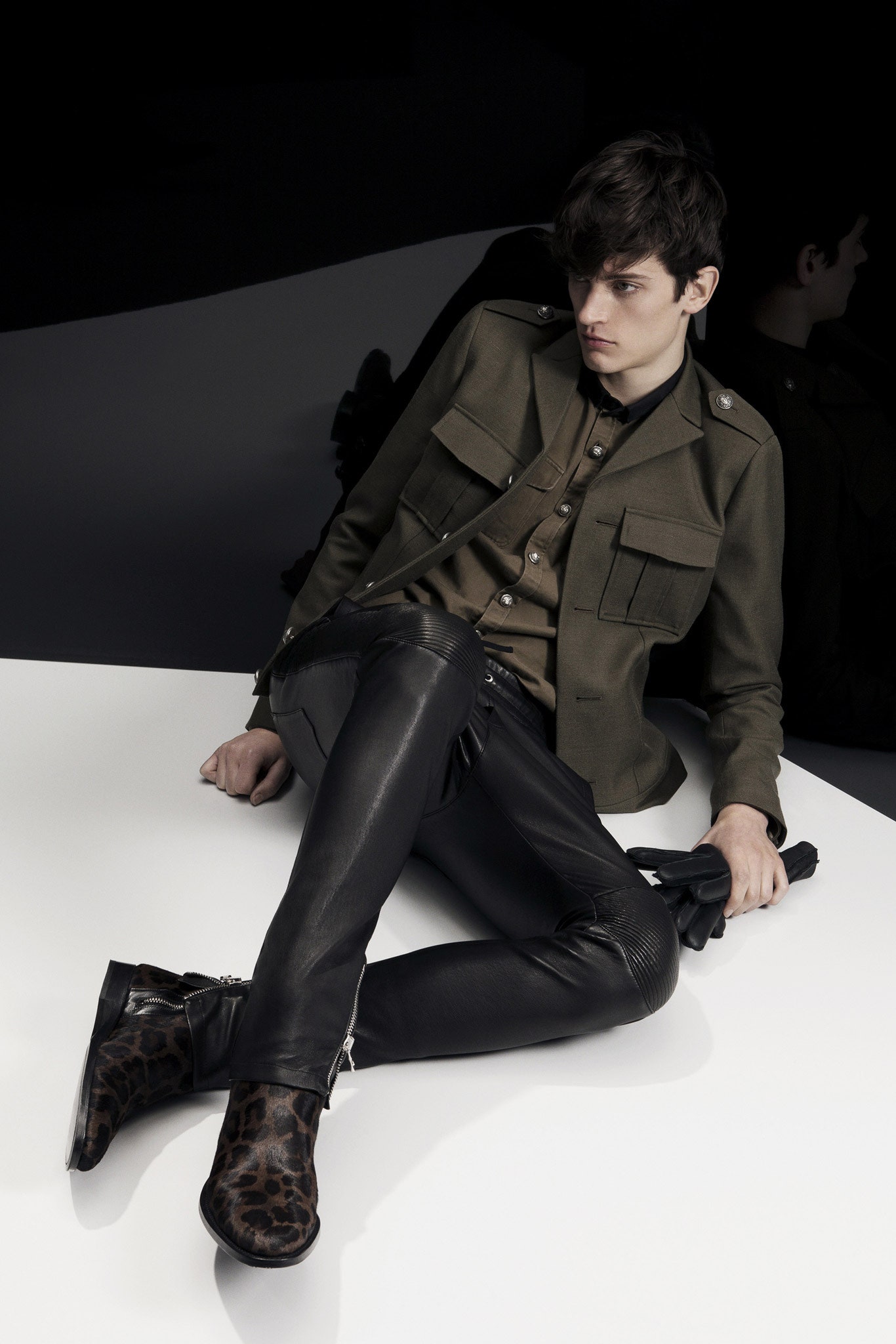 green fitted jacket with leather pants