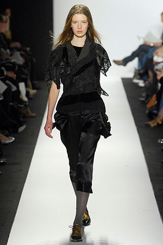 black silk ruffled top and cropped pants