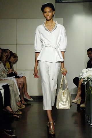 white fitted blouse with tailored pants